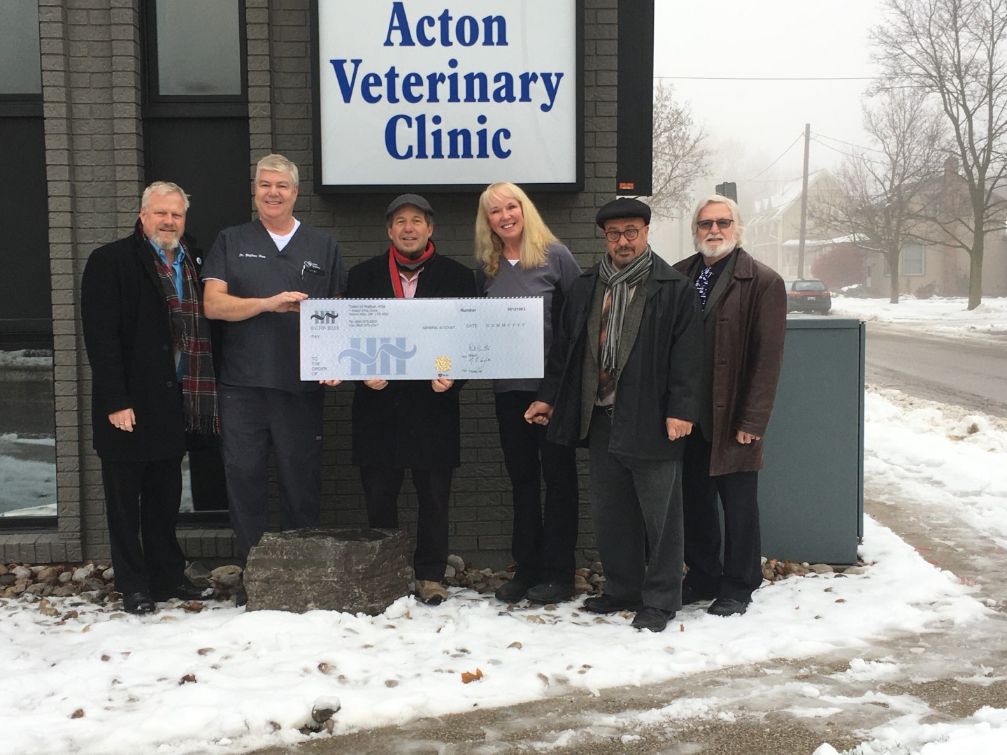 cheque presentation in front of Acton Vet