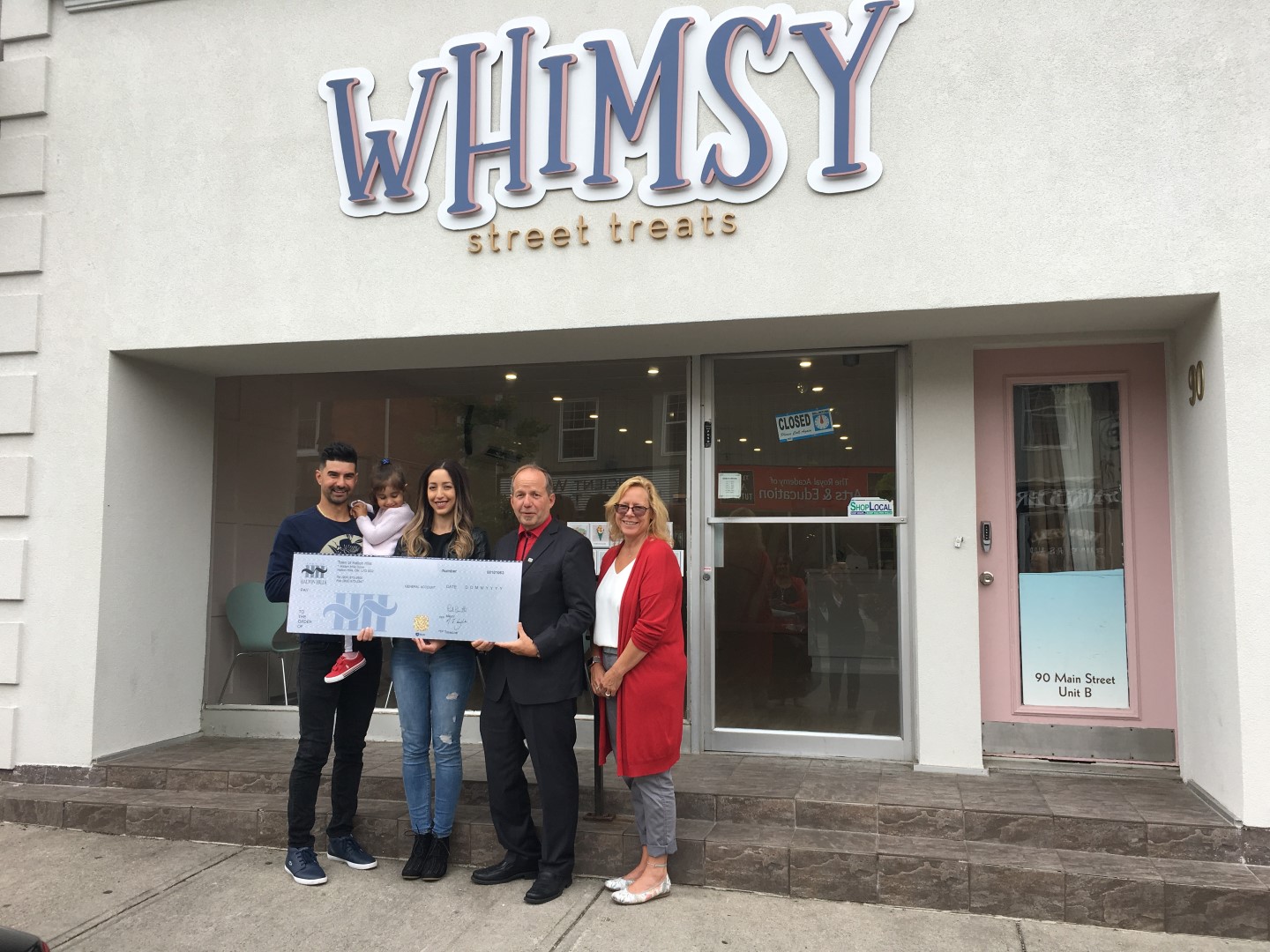 Cheque Presentation in front of Whimsy Street Treats