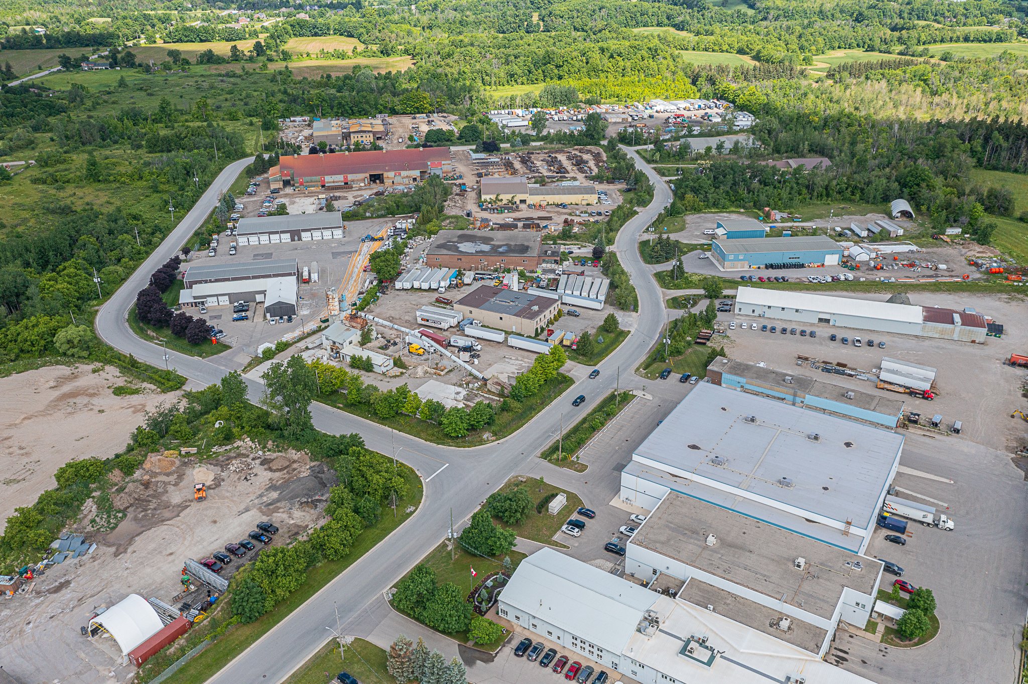 industrial area with trees behind it