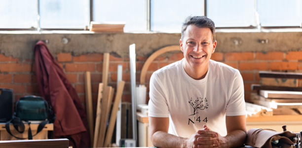 Man sitting on workbench 