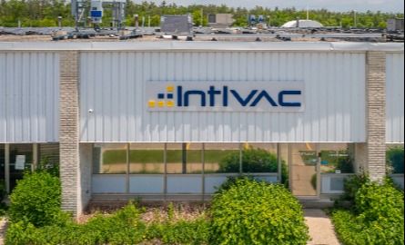 Overhead image of intlvac warehouse with blue and yellow letters